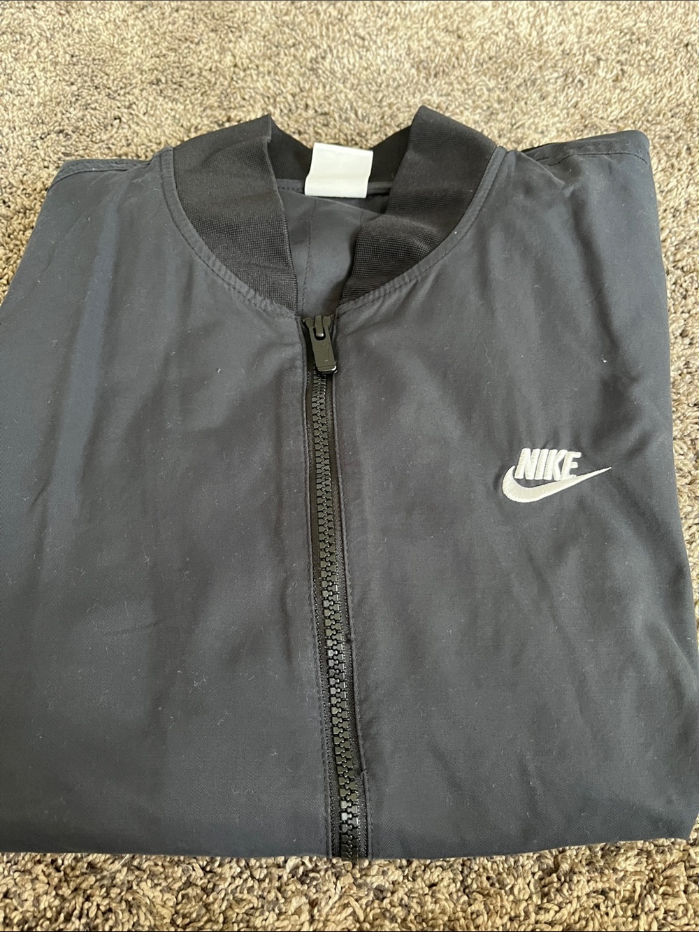 Nike Black Bomber Jacket with White Logo. Pockets. VG condition.  Medium.